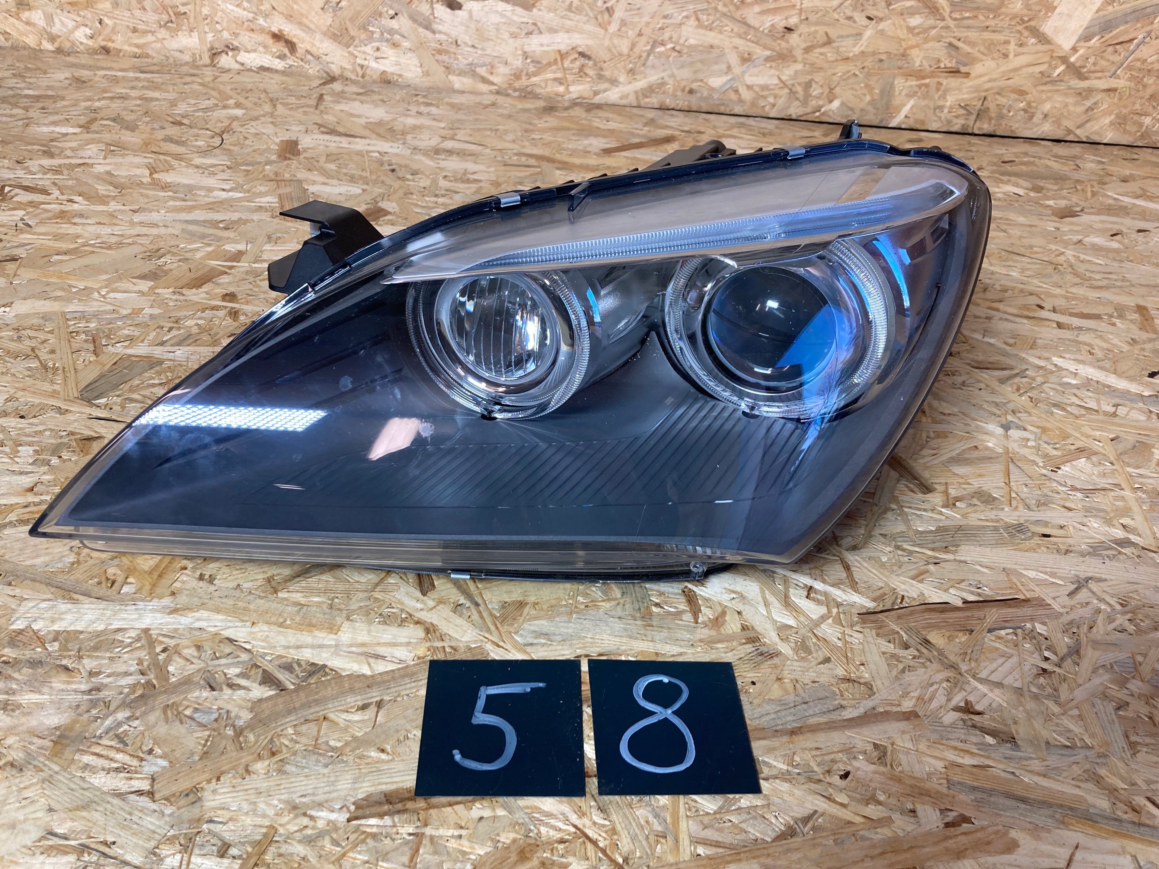 BMW 6 levý světlo 7222089